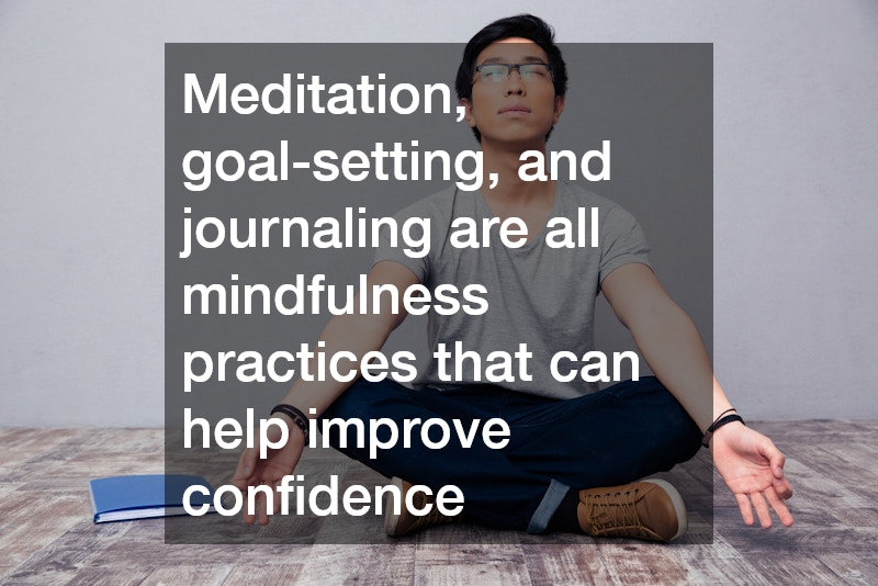 man meditating with a notebook beside him